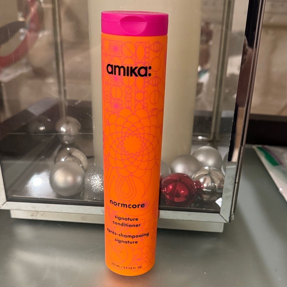 Amika Normcore Conditioner in Orange and Pink